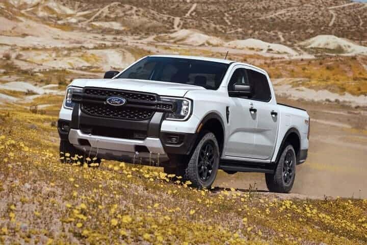 New Ford Ranger Driving up Dirt Road