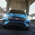 Blue Mustang Mach-E SUV on highway