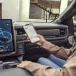 woman phone infotainment f-150 lightning truck cabin
