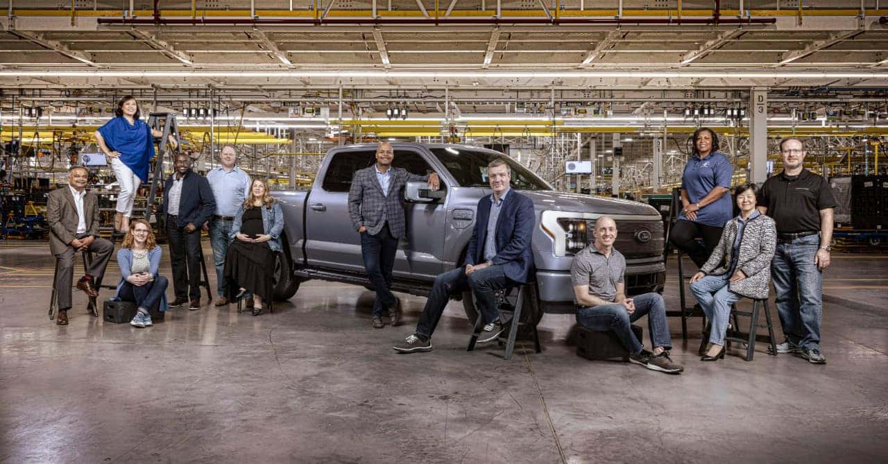 Ford Lightning gray pickup with Ford employees