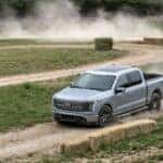 Silver Ford F-150 Lightning Pickup Dirt Road