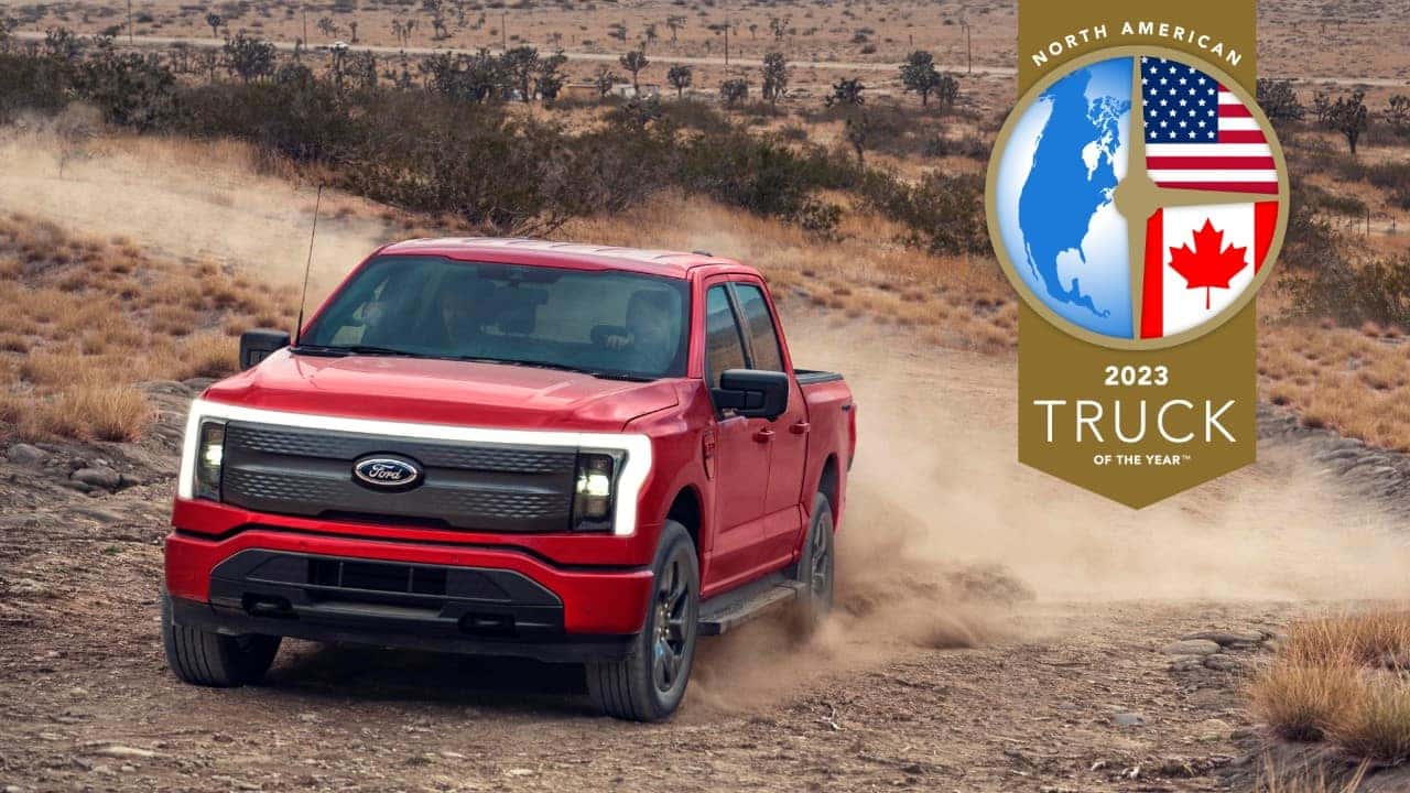 Red Ford F-150 Lightning Pickup North American Truck of the Year Desert Dirt