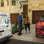 Ford Mobile Service Red Ford Escape SUV Two People