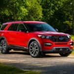 Red Ford Explorer SUV Trees