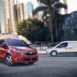 Red and Gray Ford Transit Connect Vans Buildings