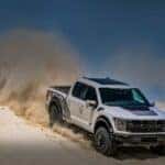 Silver Ford F-150 Raptor Pickup Truck Brown Sand Blue Sky
