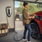 Red Ford Pickup Truck Electric Charger People Chair Bag Trees Bike