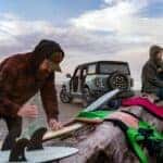 People Blankets Surf Boards Blue Ford Bronco SUV Sand