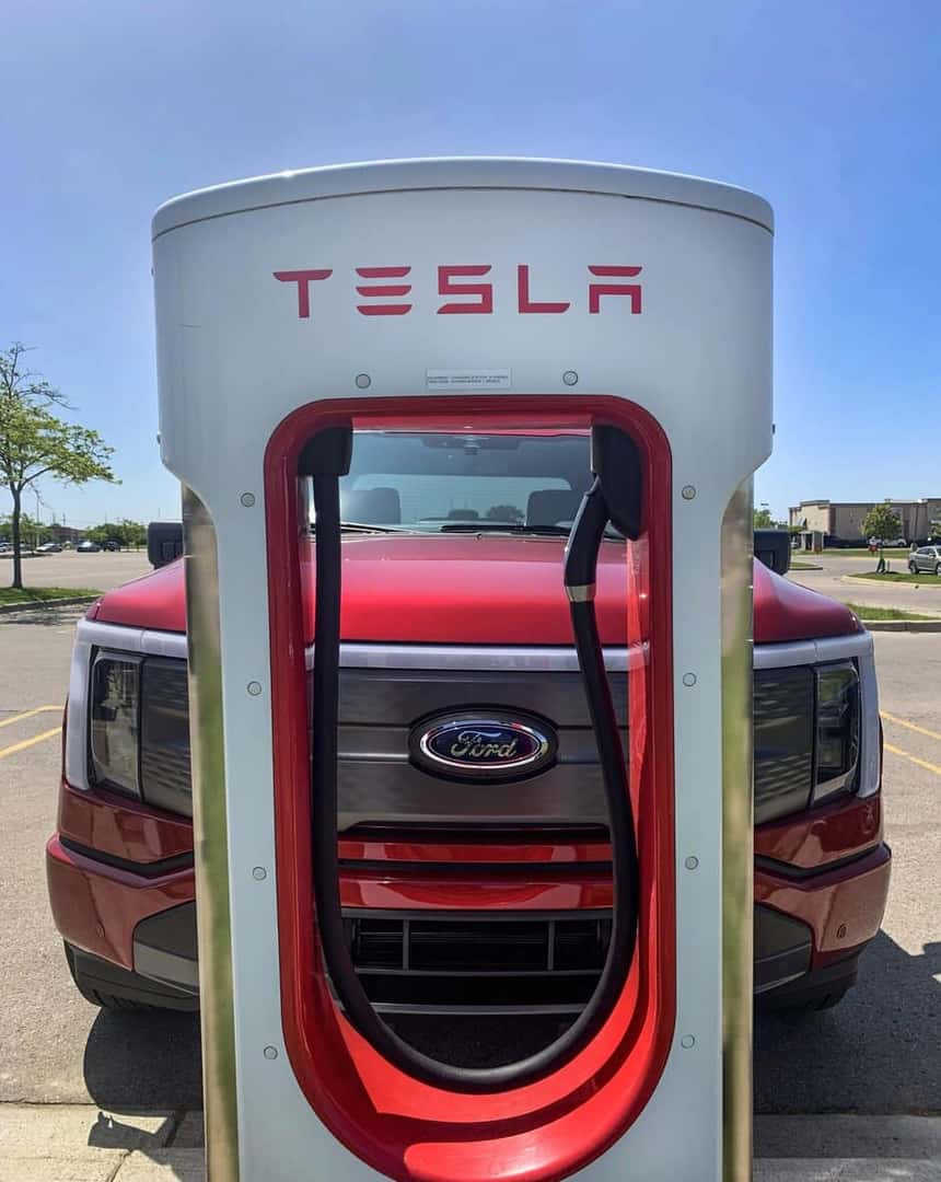 Red Ford Pickup Truck Tesla Charging Station