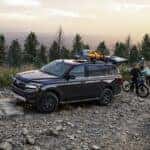 Black Ford Expedition SUV Bike Trees Orange Kayak