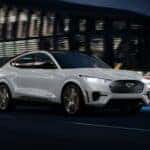 White Ford Mustang Mach-E EV SUV Building