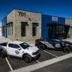 White Blue Ford Ranger Raptor Pickup Truck Building