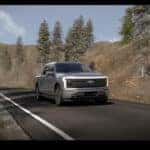 Silver Ford F150 Lightning Pickup Truck Green Trees