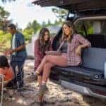 2025 Ford Expedition on a off road terrain in the daytime with people relaxing around the exterior