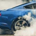Blue Mustang Sports Car Tires Smoke