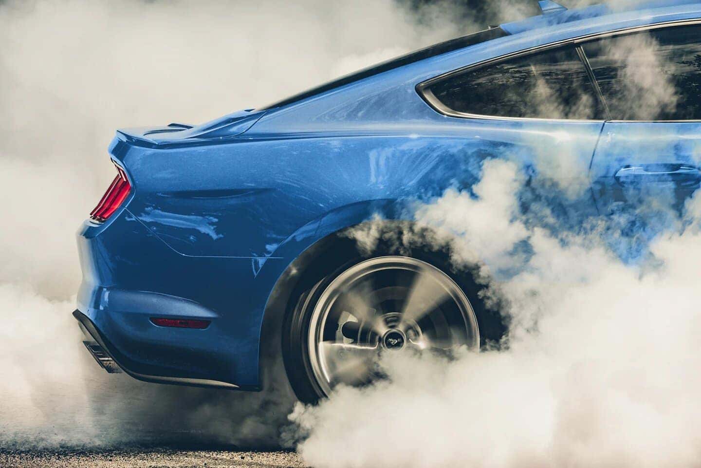 Blue Mustang Sports Car Tires Smoke