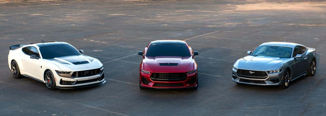 Three Ford Mustangs Outside