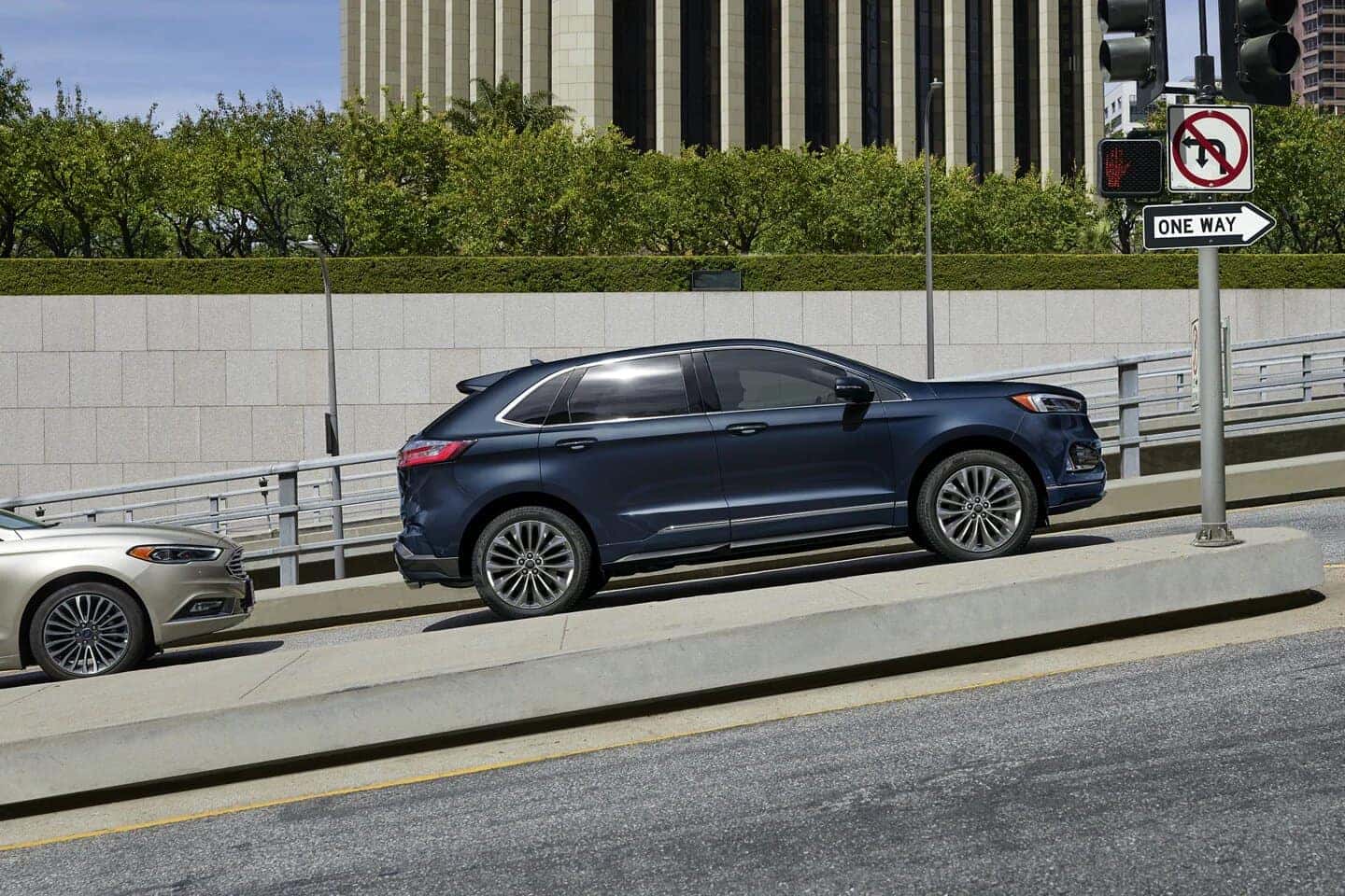 Blue Ford Edge SUV Outside Buildings Bushes