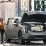 Gray Ford F-150 Lightning Truck Bags Woman Buildings