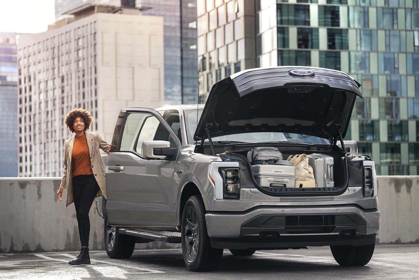 Gray Ford F-150 Lightning Truck Bags Woman Buildings