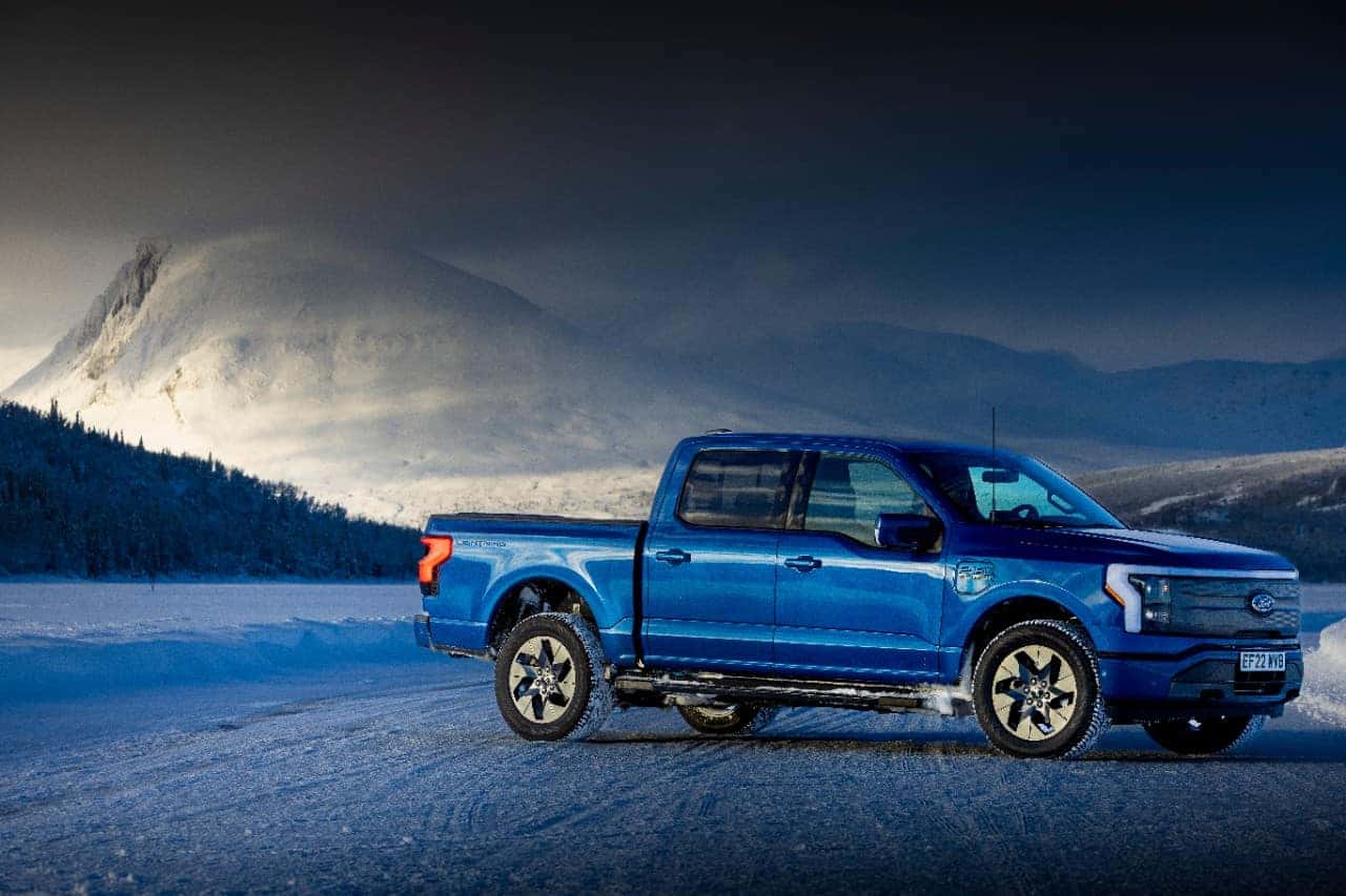 Blue Ford F-150 Lightning Pickup Truck Mountain Trees