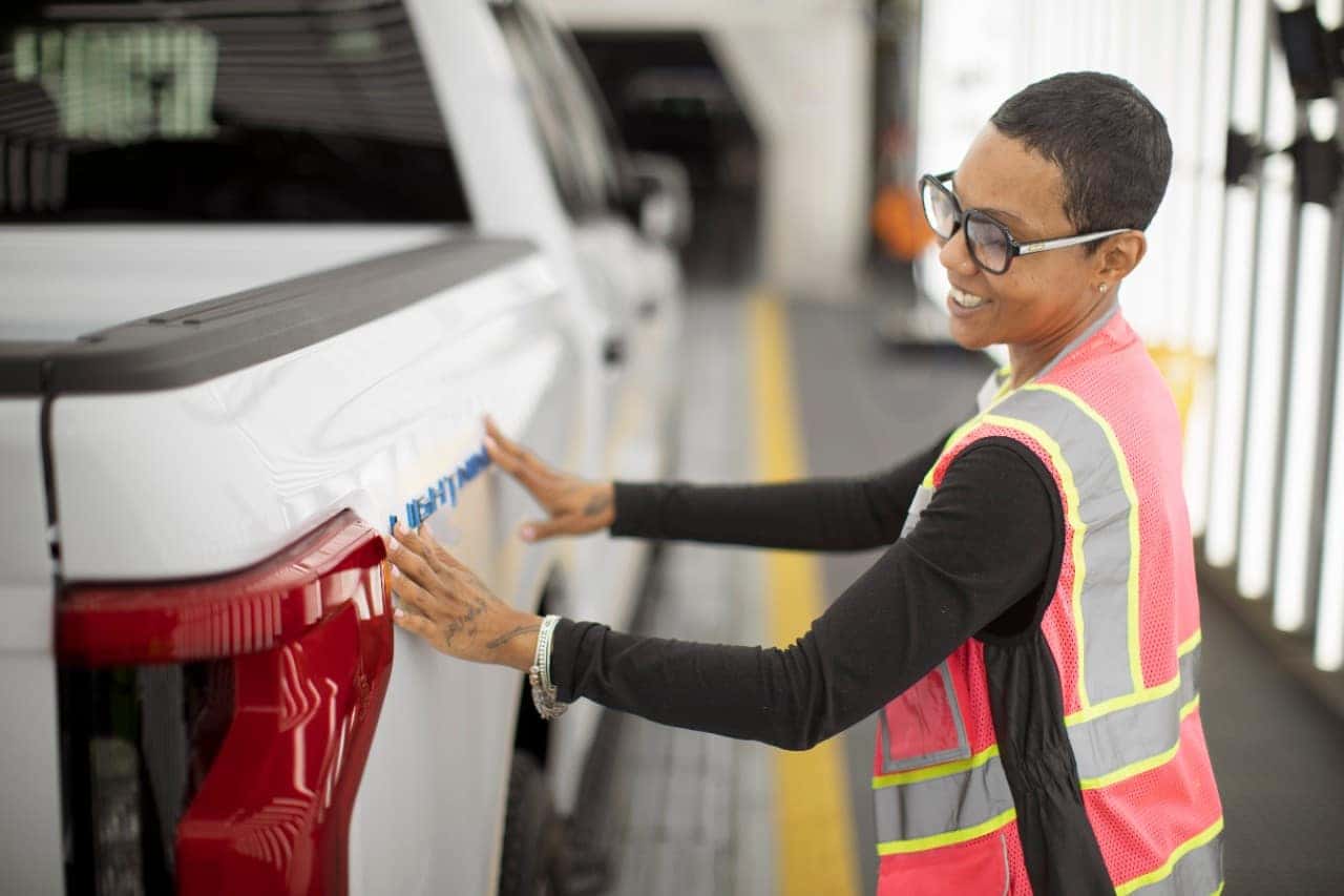 White Ford F-150 Lightning EV Truck Beautiful Black Woman