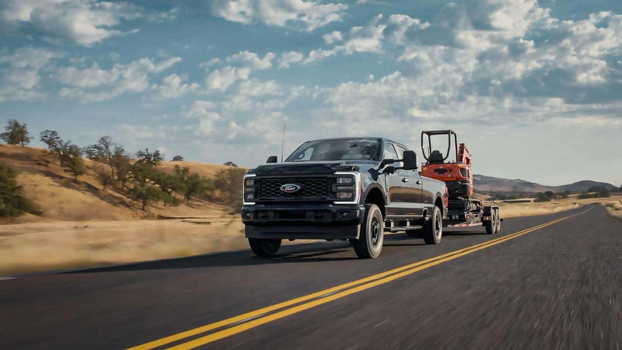 Black Ford F-150 Pickup Truck Tractor Brown Grass