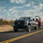 Black Ford F-150 Pickup Truck Tractor Brown Grass