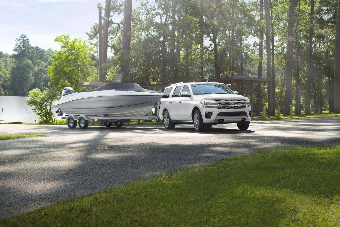 White Ford Expedition SUV White Boat Trees Gras Water