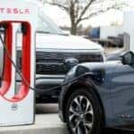 Blue Ford Mustang Mach E SUV Tesla Charging Station Gray Pickup Truck