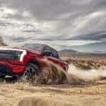 Red Ford F-150 Lightning EV Pickup Truck Red Dirt
