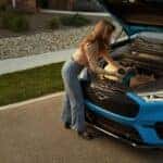 Woman Blue Ford Mustang Mach-E Front Trunk SUV Electric EV