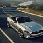Silver 2018 Ford Mustang on highway in hills