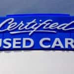 Large blue certified used cars sign