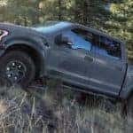 Gray Ford F150 climbing a mountain