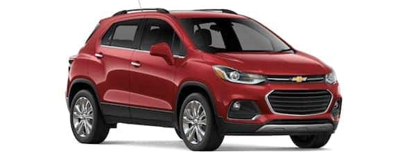 A red 2019 Chevy Trax facing right on white