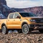 An orange 2019 Ford Ranger with mountains in the back