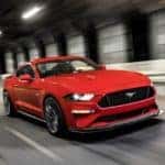 A red 2019 Mustang races through a tunnel from Ford Dealers in Ohio