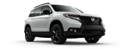 A white 2019 Honda Passport is angled right.