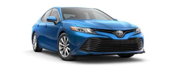 A blue 2019 Toyota Camry is facing right.
