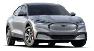 A silver 2021 Ford Mustang Mach-E is facing right.