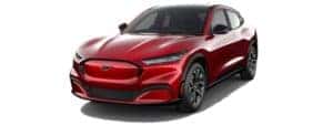 A red 2021 Ford Mustang Mach-E is facing left.