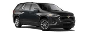 A black 2020 Chevy Traverse is facing right.