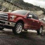 A red 2017 Ford F-150, which is popular among used Ford trucks, is backing a boat into the water near Cincinnati, OH.
