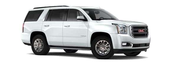 A white 2020 GMC Yukon is angled right.