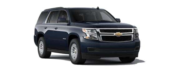 A blue 2020 Chevy Tahoe is angled right.