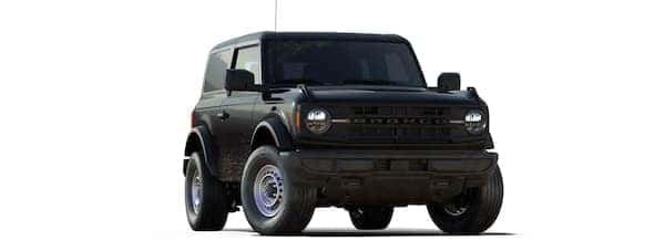 A black 2021 Ford Bronco two-door is angled right.