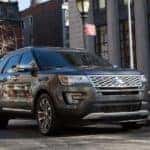 A gray 2016 used Ford Explorer is driving on a street in Cincinnati.