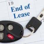 A set of keys is shown resting on a calendar with a date marked for Ford end-of-lease.