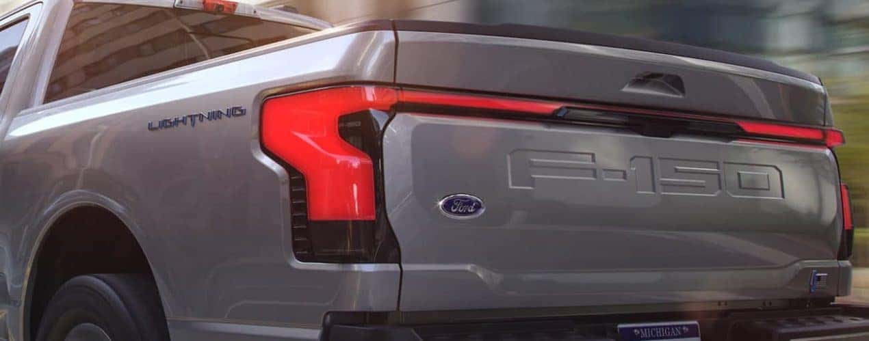 The taillight on a grey 2022 Ford F-150 Lightning is shown.
